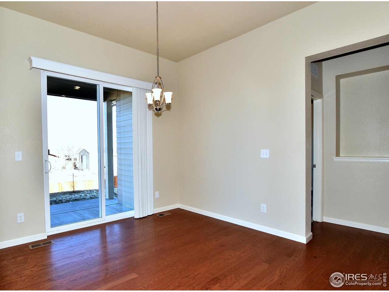 882 Wagon Bend Road Berthoud, CO 80513 - Photo 8 of 31 Eat-in kitchen overlooks covered patio. Notice the art niches!