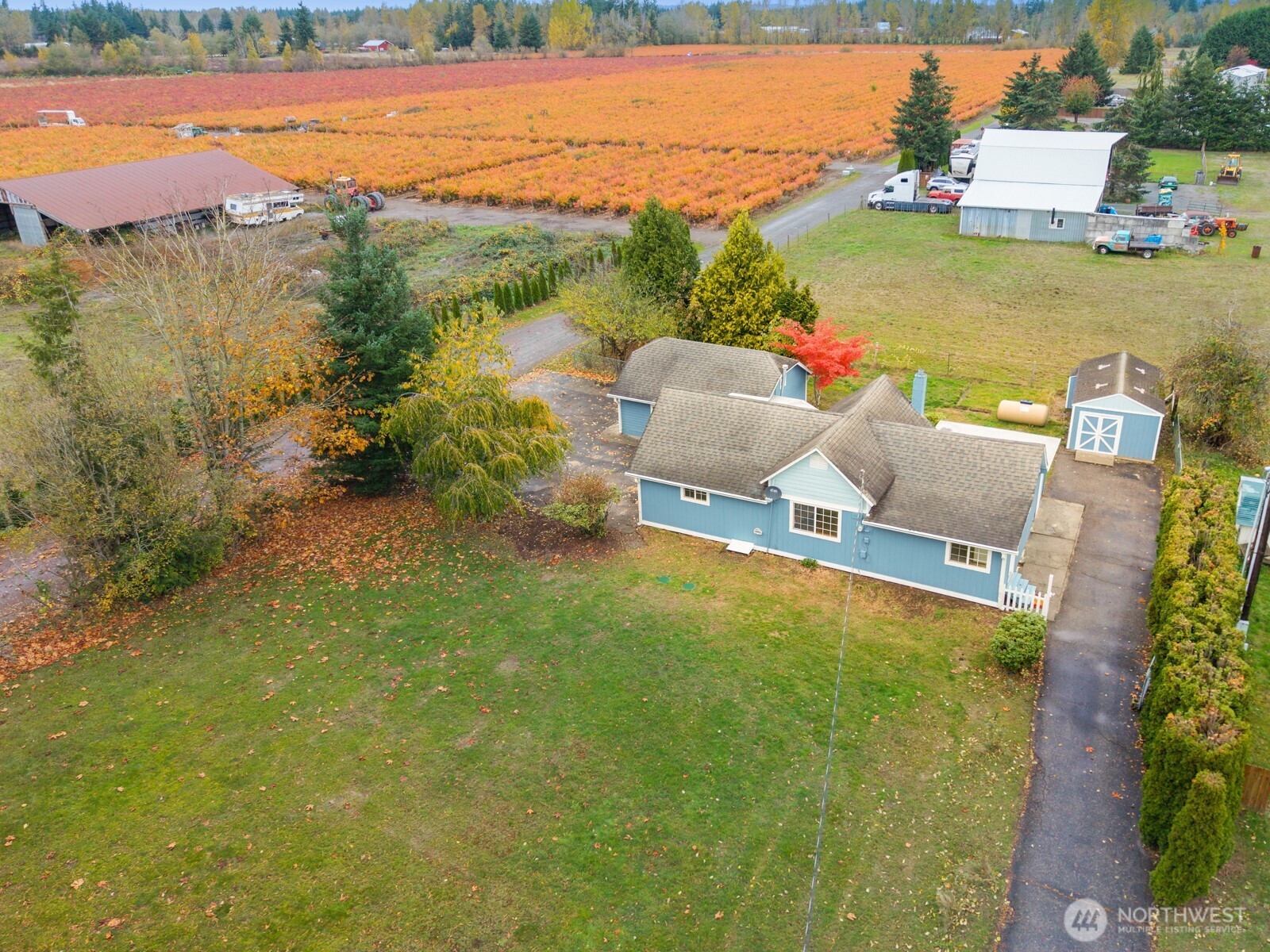 an aerial view of a house with a lake view