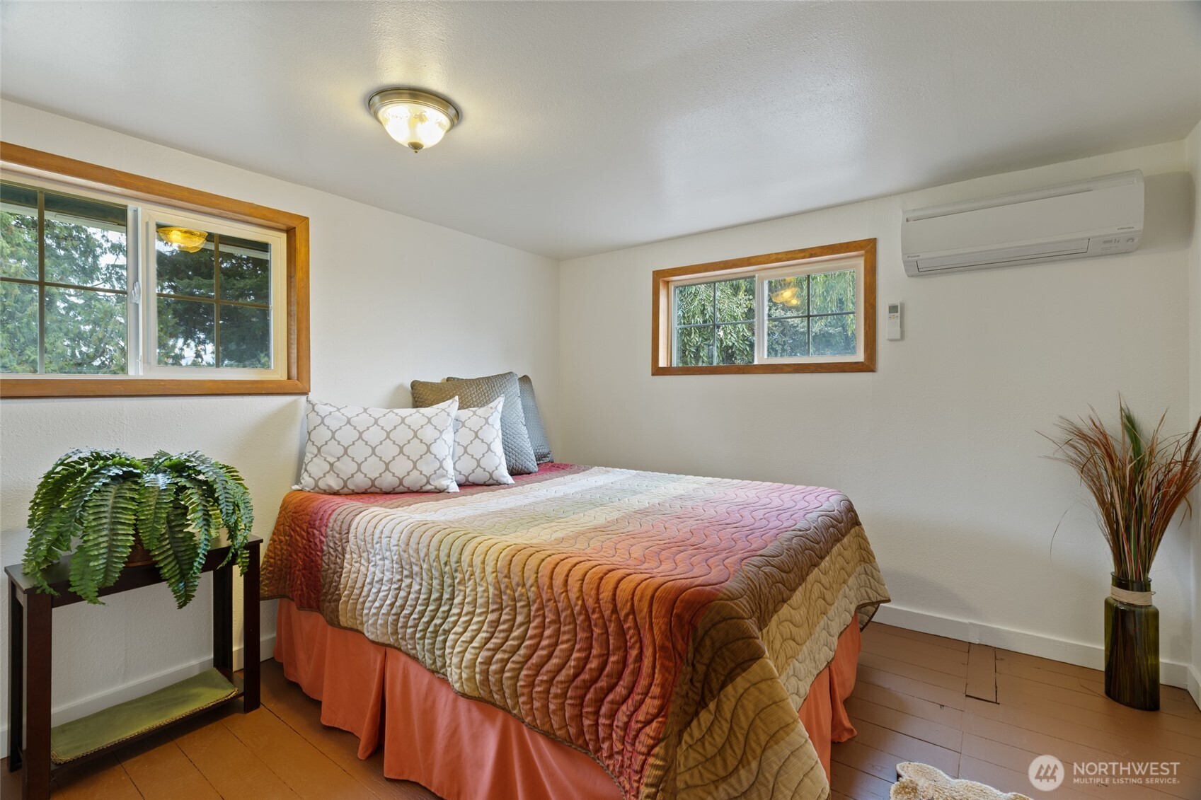 7007 Dahlberg Road Ferndale, WA 98248 - Photo 16 of 35 a bedroom with a bed and a potted plant