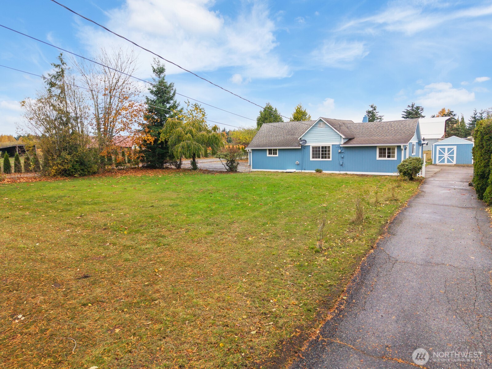 7007 Dahlberg Road Ferndale, WA 98248 - Photo 4 of 35 a front view of a house with a yard and lake view