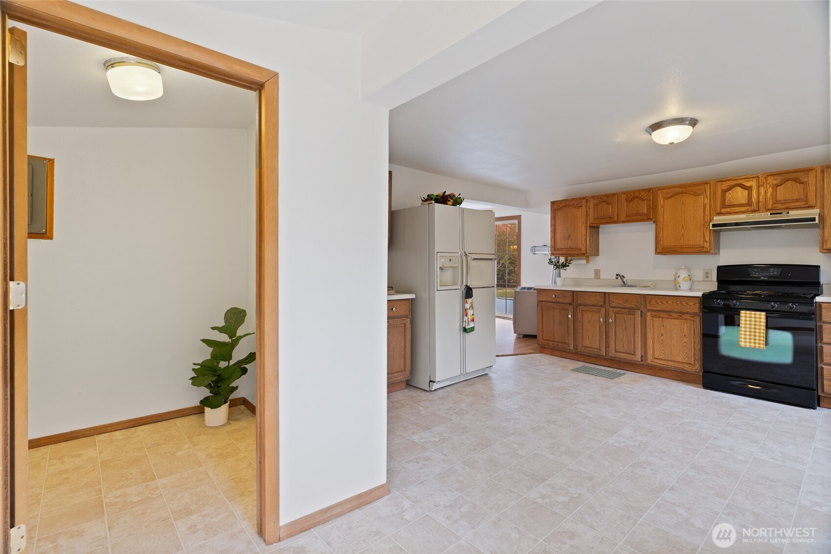 7007 Dahlberg Road Ferndale, WA 98248 - Photo 5 of 35 a view of a kitchen with a sink and a refrigerator