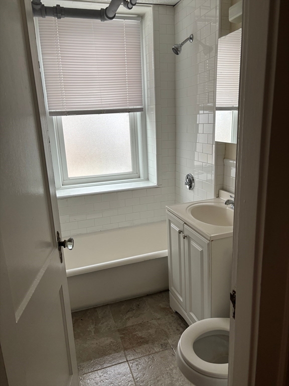 50 Broadway, Unit 34 Beverly, MA 01915 - Photo 5 of 5 a bathroom with a tub a sink and a window