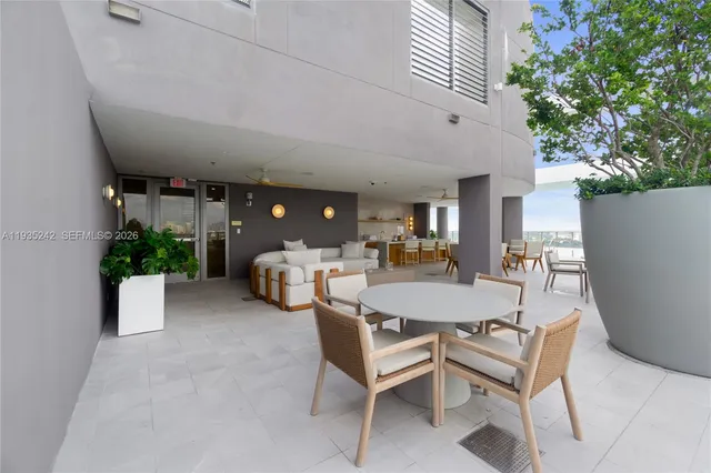 a view of entryway with lots of green space