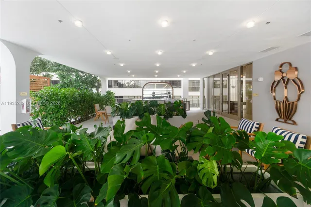 a view of a patio with a table and chairs