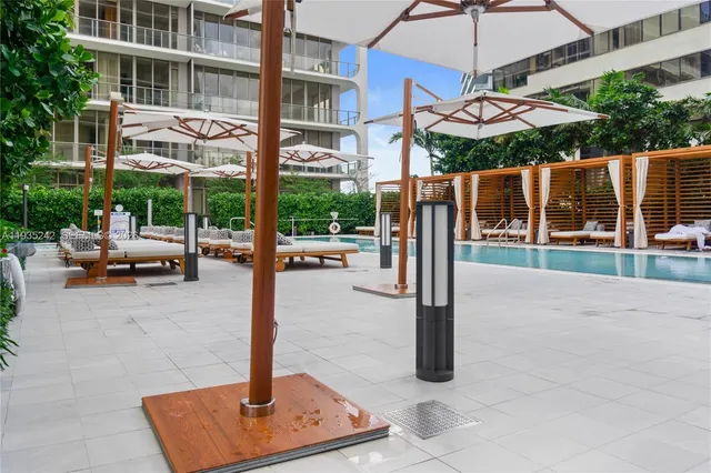 a view of a swimming pool with a lounge chairs