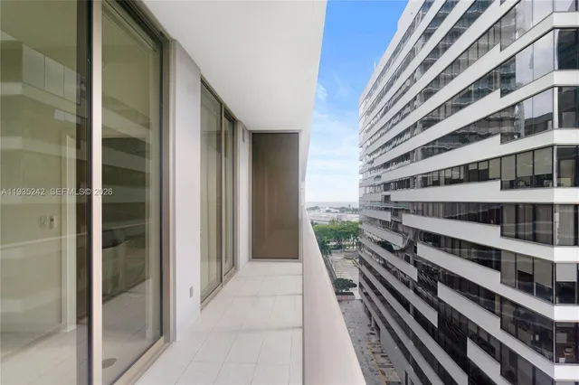 a view of an empty room with a sliding door