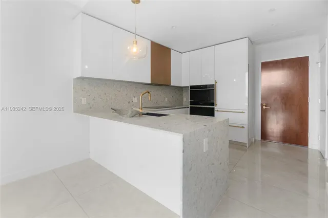 a close view of a sink and a window in a room