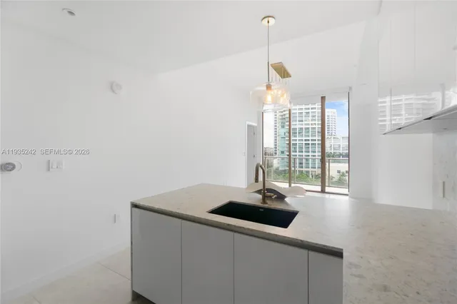a kitchen with a sink and cabinets