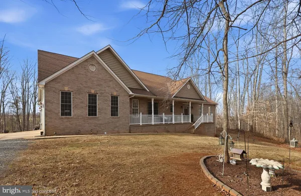 a front view of a house with yard