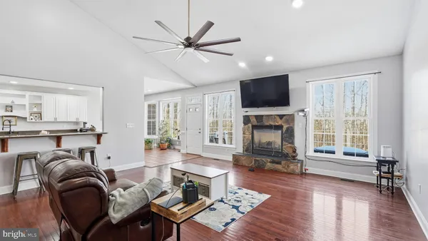 a living room with furniture fireplace and flat screen tv