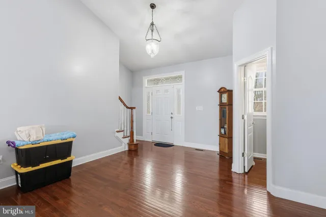 a large kitchen with stainless steel appliances granite countertop a refrigerator and a stove