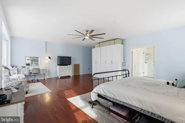 a bathroom with a bathtub a sink and a window