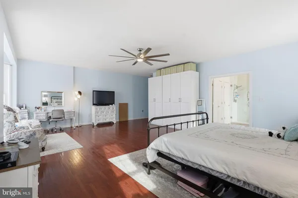 a bathroom with a bathtub a sink and a window
