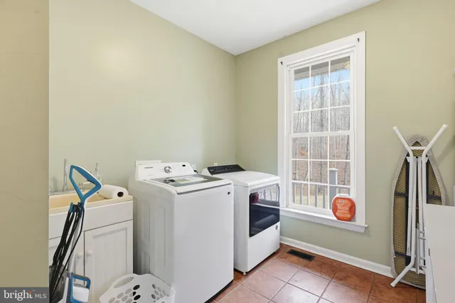a bedroom with furniture and a book shelf