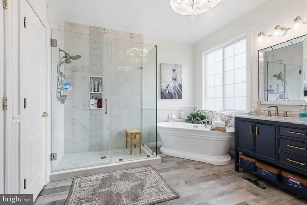 a bathroom with a shower and a bathtub