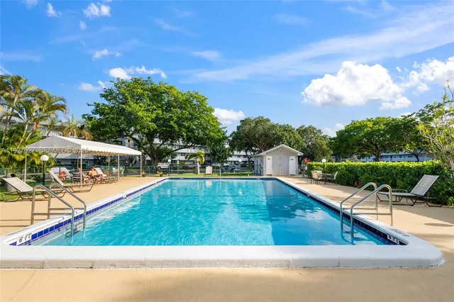 a view of a swimming pool with a patio