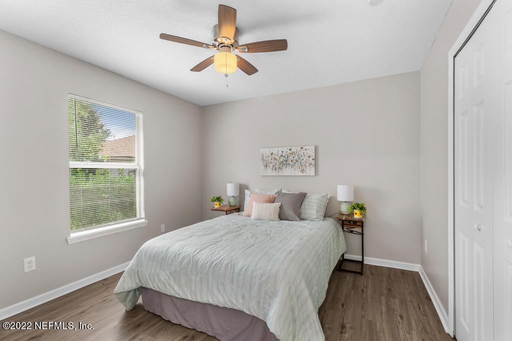 1229 Paradise Pond Road St. Augustine, FL 32092 - Photo 12 of 23 a bedroom with a bed and a window