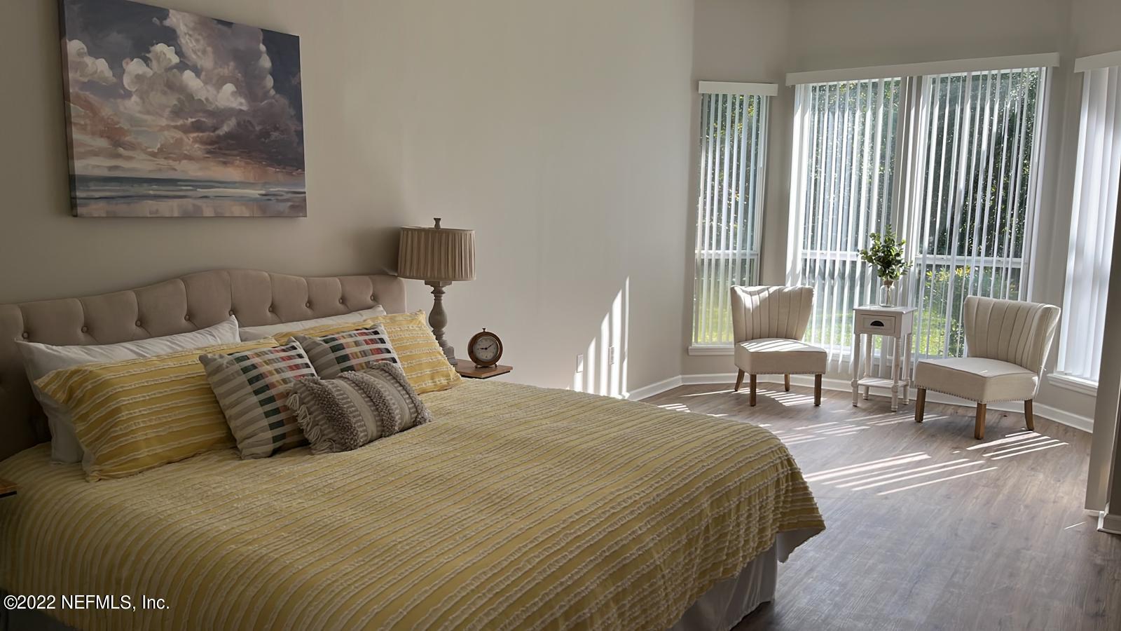 1229 Paradise Pond Road St. Augustine, FL 32092 - Photo 17 of 23 a bedroom with a bed and wooden floor