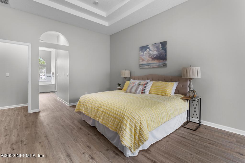 1229 Paradise Pond Road St. Augustine, FL 32092 - Photo 18 of 23 a bedroom with bed and night stand