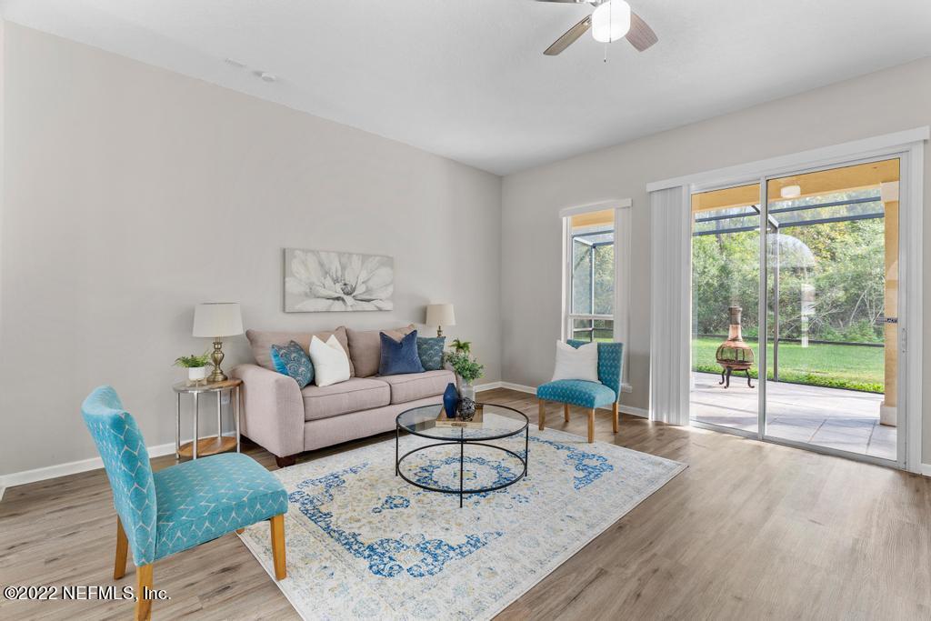 1229 Paradise Pond Road St. Augustine, FL 32092 - Photo 4 of 23 a living room with furniture and a large window