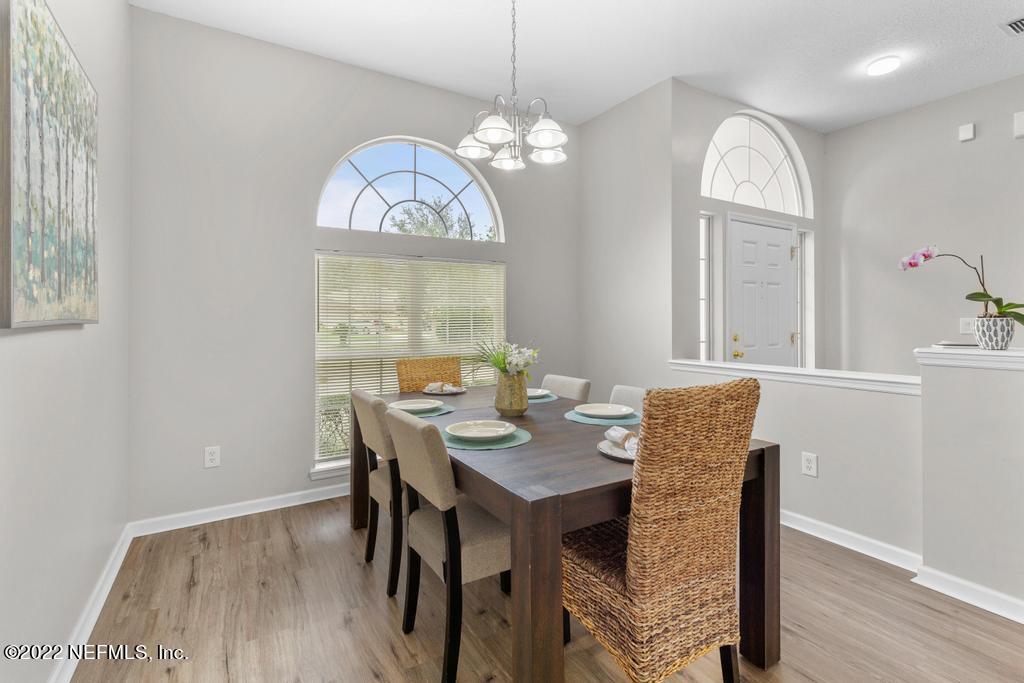 1229 Paradise Pond Road St. Augustine, FL 32092 - Photo 10 of 23 a view of a dining room with furniture window and wooden floor