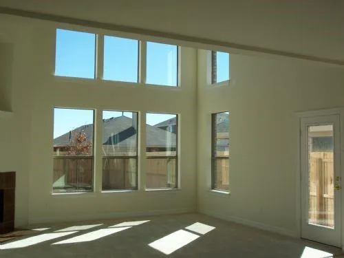 a view of a livingroom with an empty space and a window