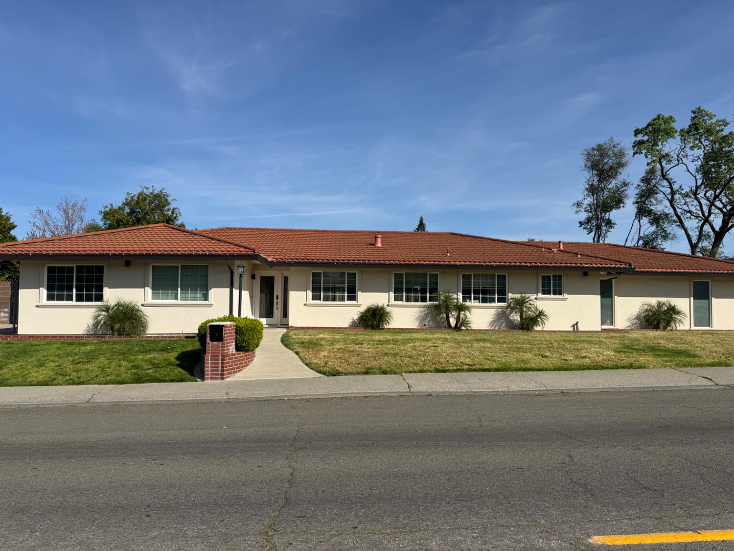 a front view of a house with a yard