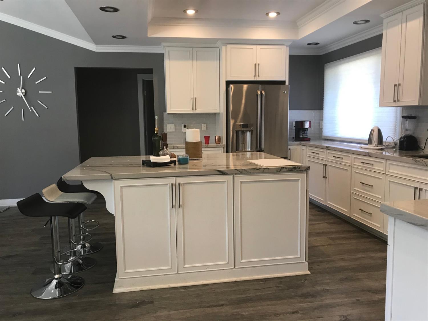 4448 Hackberry Lane Carmichael, CA 95608 - Photo 19 of 64 a kitchen with stainless steel appliances granite countertop a sink stove and refrigerator