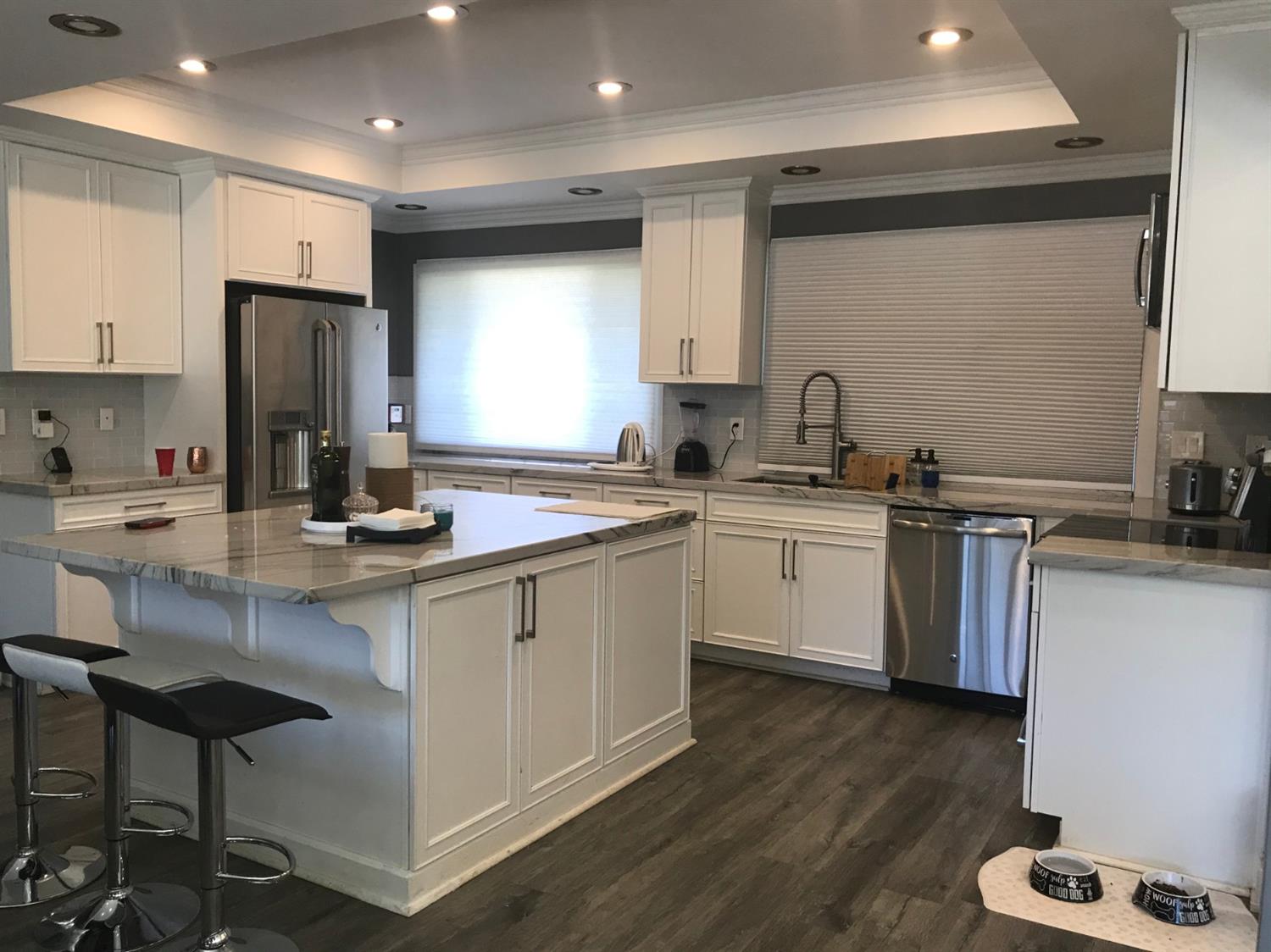 4448 Hackberry Lane Carmichael, CA 95608 - Photo 20 of 64 a kitchen with a sink stainless steel appliances and cabinets