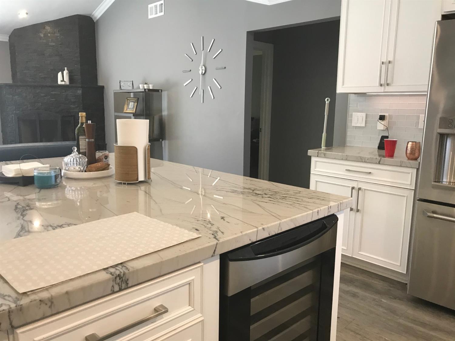 4448 Hackberry Lane Carmichael, CA 95608 - Photo 27 of 64 a kitchen with a sink and cabinets