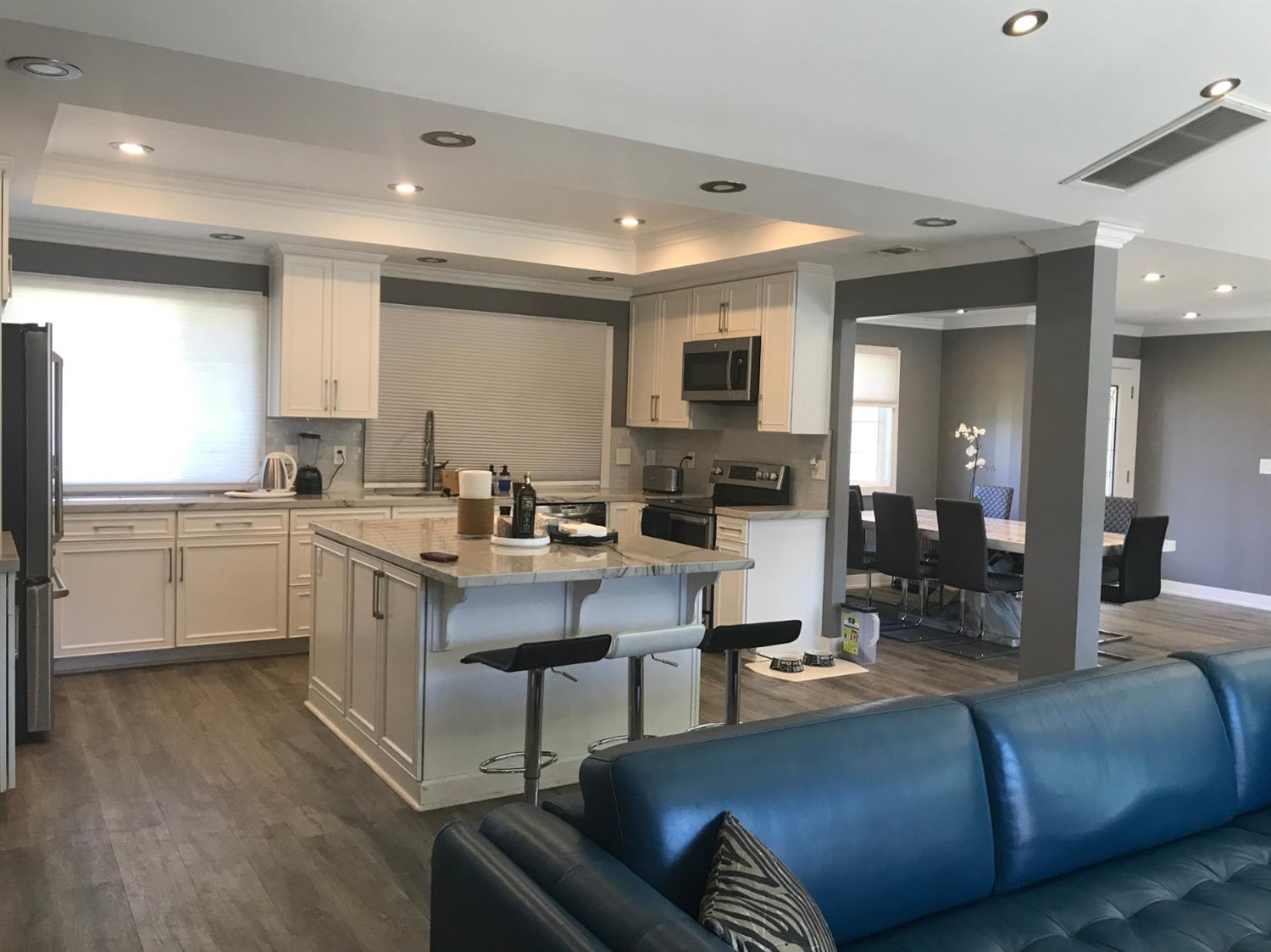 4448 Hackberry Lane Carmichael, CA 95608 - Photo 34 of 64 a living room with kitchen island furniture and a kitchen view