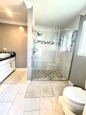 a view of backyard with swimming pool and seating space