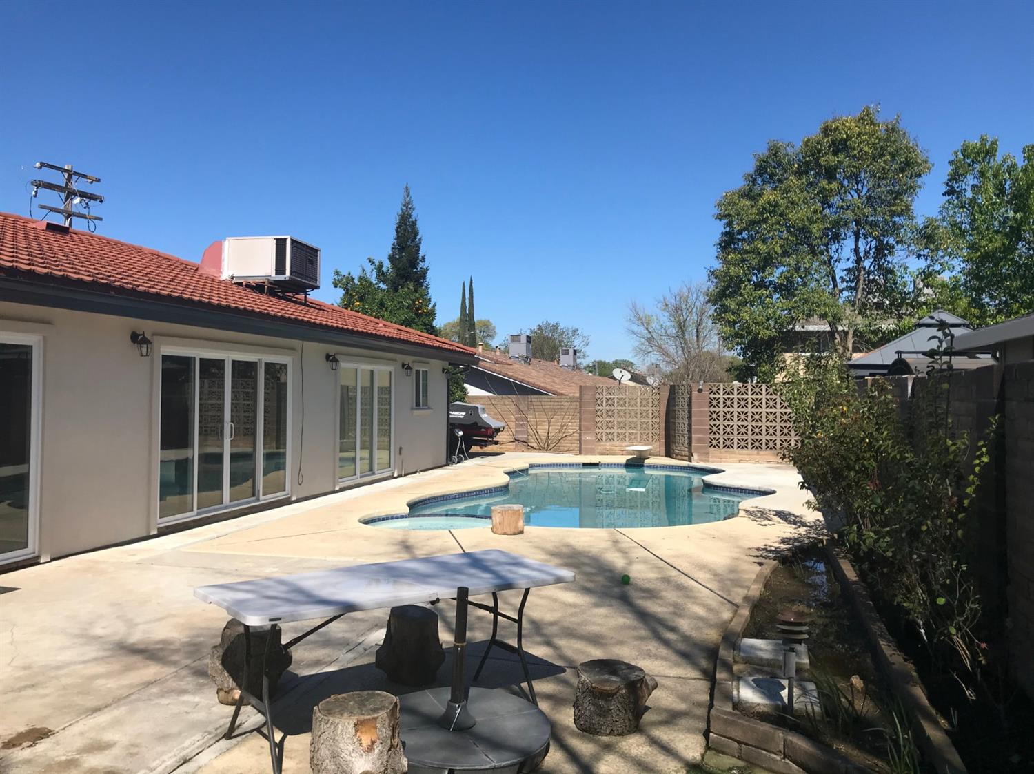 4448 Hackberry Lane Carmichael, CA 95608 - Photo 53 of 64 a view of backyard with swimming pool and seating space