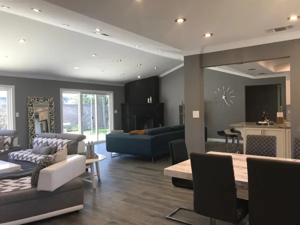 a living room with furniture window and wooden floor