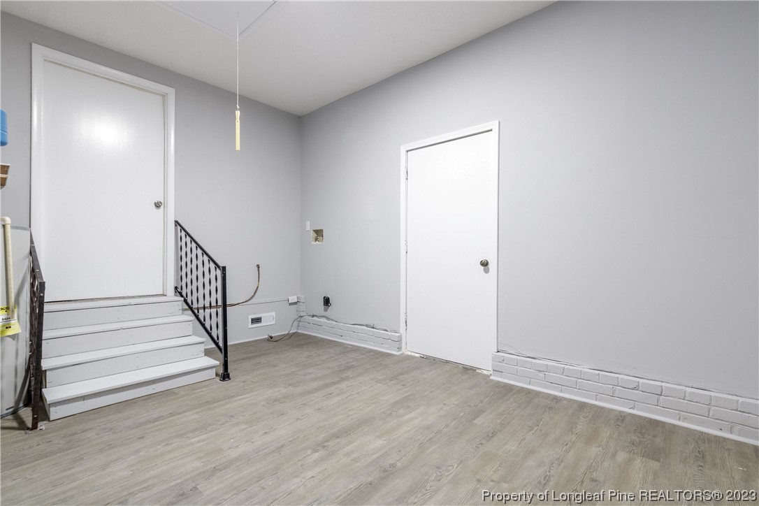 1412 Milton Street Spring Lake, NC 28390 - Photo 17 of 27 a view of entryway with wooden floor