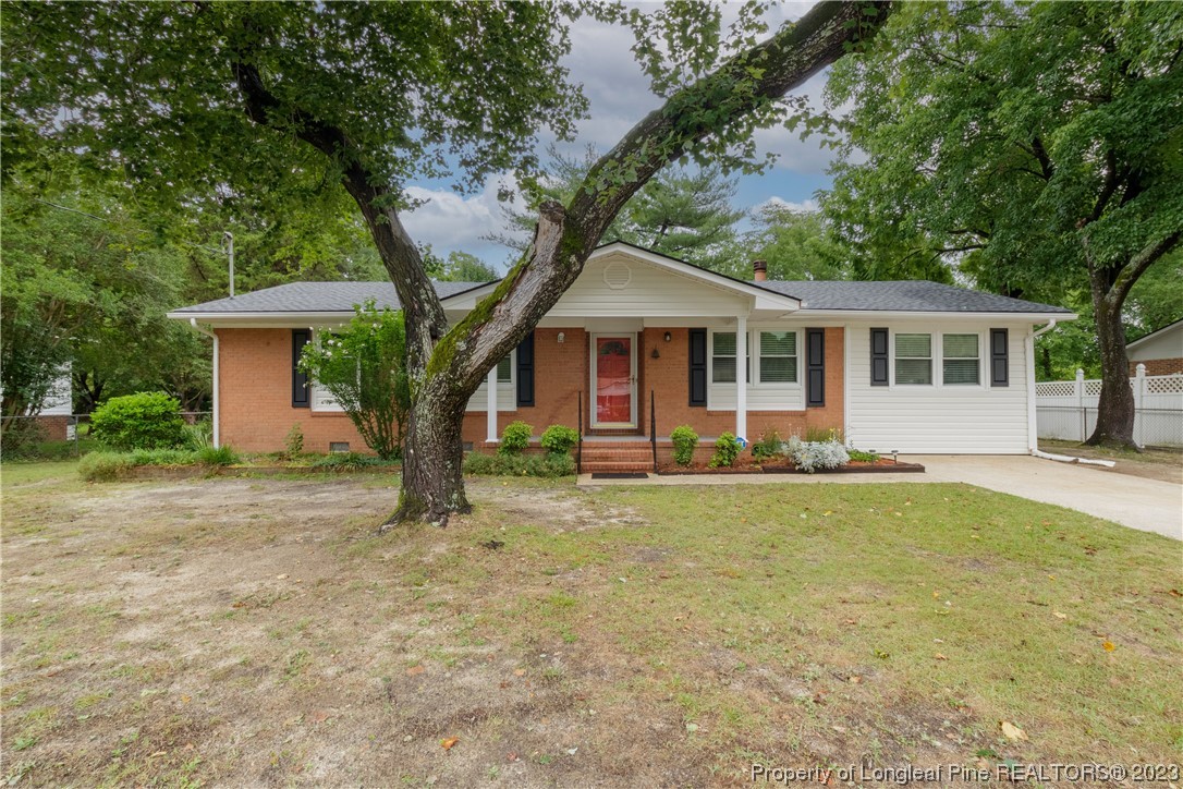 1412 Milton Street Spring Lake, NC 28390 - Photo 2 of 27 front view of a house with a yard