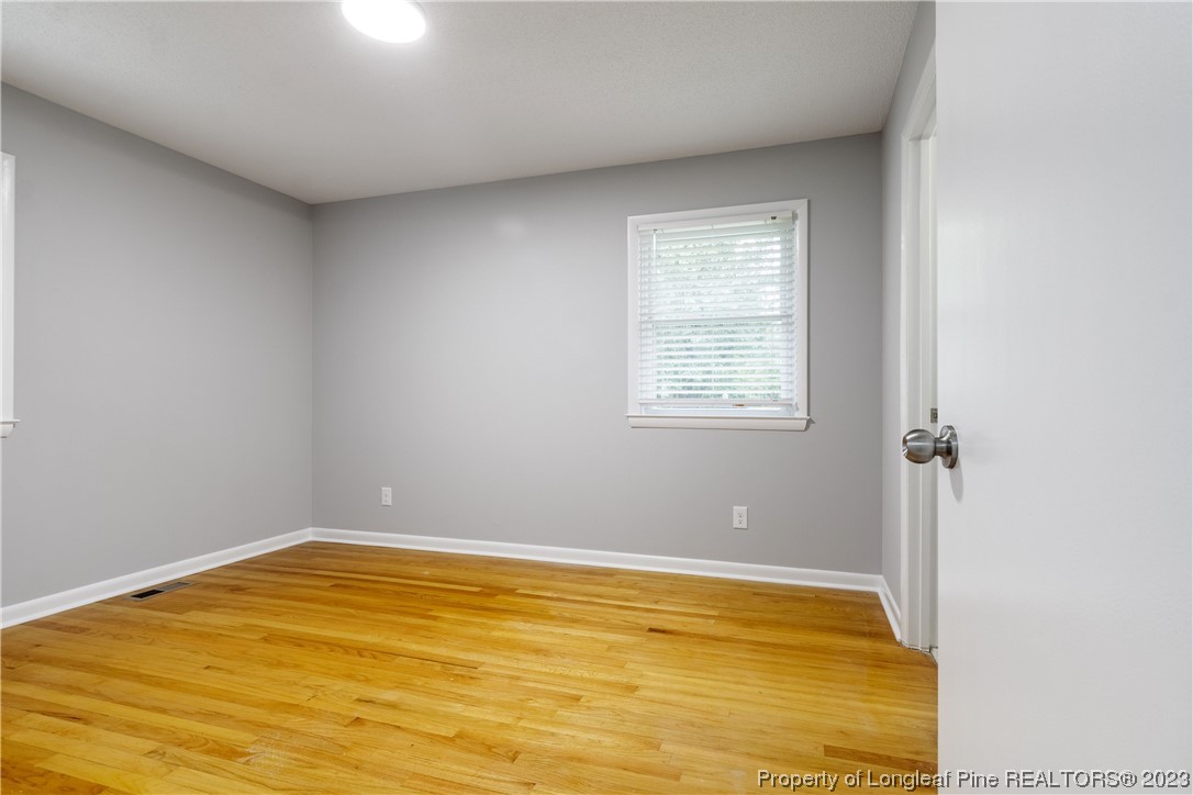 1412 Milton Street Spring Lake, NC 28390 - Photo 23 of 27 a view of a room with wooden floor and pool table