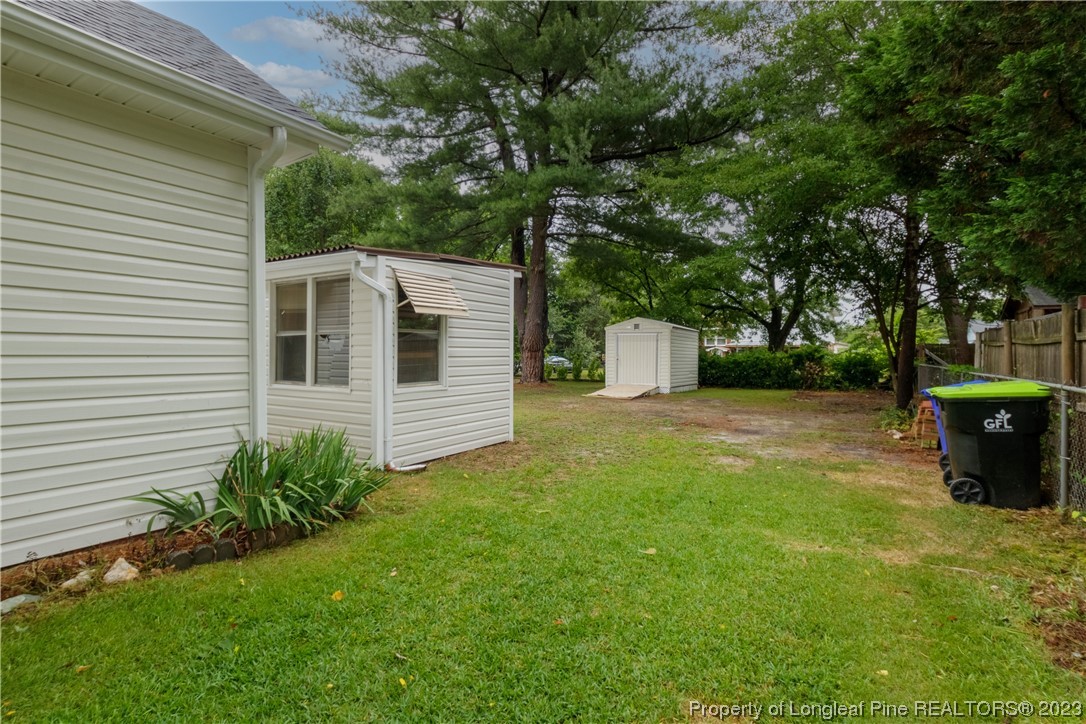 1412 Milton Street Spring Lake, NC 28390 - Photo 25 of 27 a front view of a house with garden