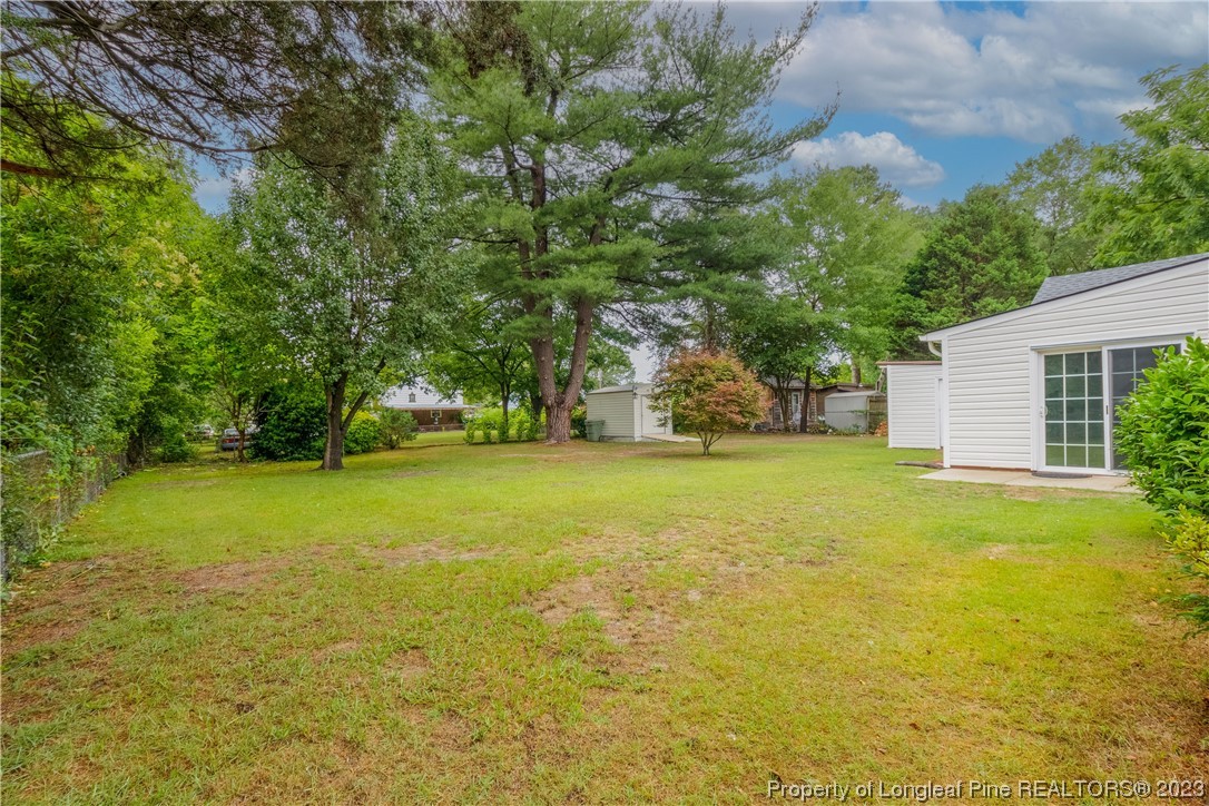 1412 Milton Street Spring Lake, NC 28390 - Photo 27 of 27 a view of outdoor space with deck area and garden