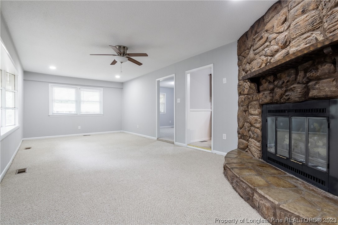 1412 Milton Street Spring Lake, NC 28390 - Photo 9 of 27 a view of empty room with window and fireplace