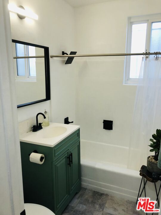 815 Pacific Avenue, Unit 9 Long Beach, CA 90813 - Photo 16 of 25 a bathroom with a sink a toilet and shower