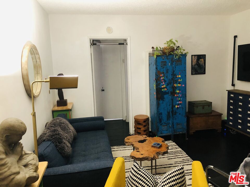 815 Pacific Avenue, Unit 9 Long Beach, CA 90813 - Photo 3 of 25 a living room with furniture and a wooden floor