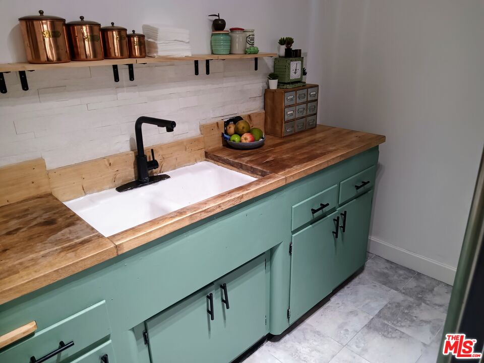 815 Pacific Avenue, Unit 9 Long Beach, CA 90813 - Photo 9 of 25 a kitchen with a sink cabinets and appliances