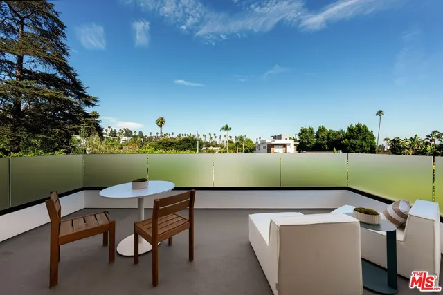 a view of outdoor sitting area with furniture