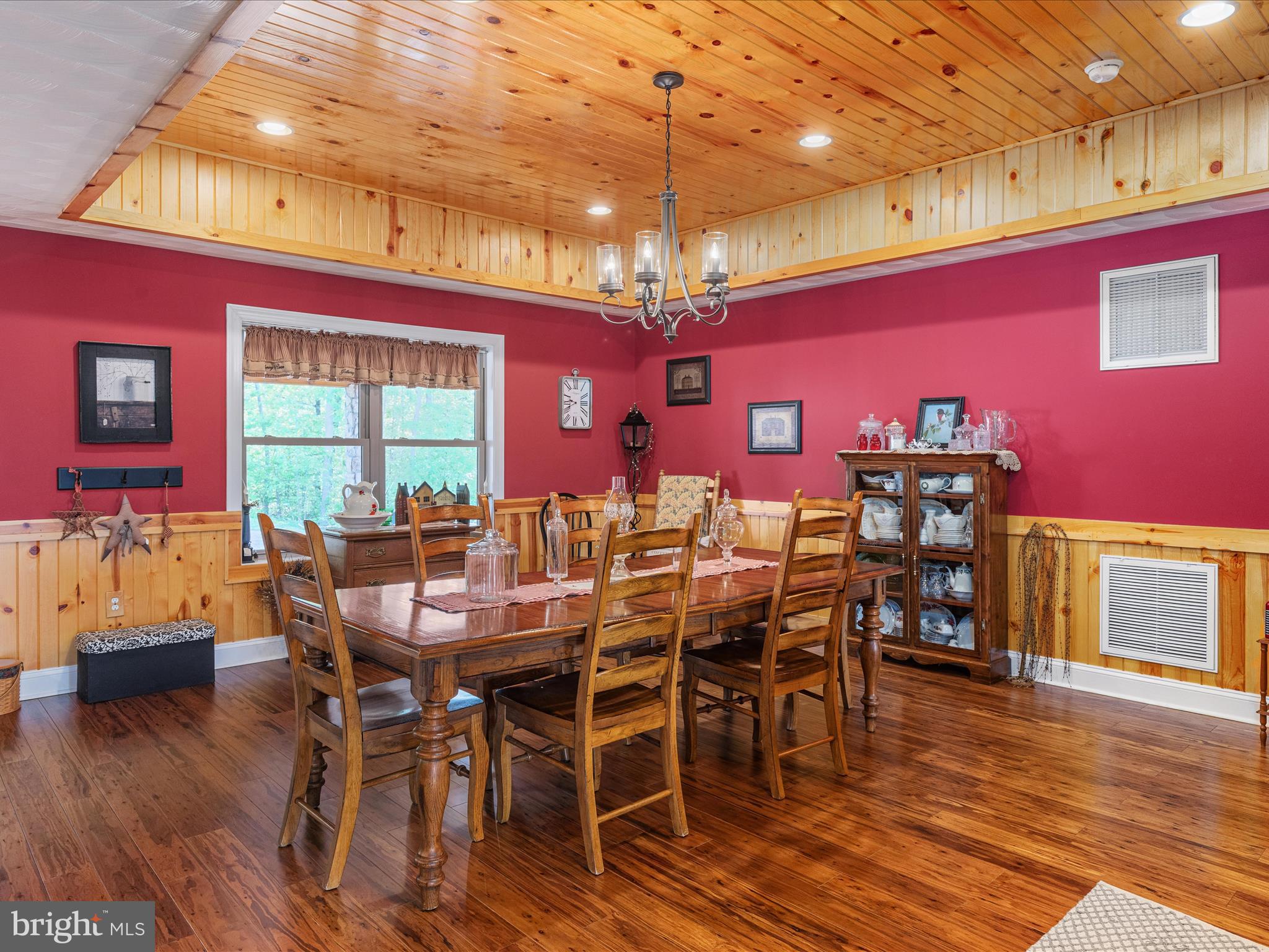 1996 Buck Mountain Road Bentonville, VA 22610 - Photo 14 of 61 a view of a dining room with furniture window and wooden floor