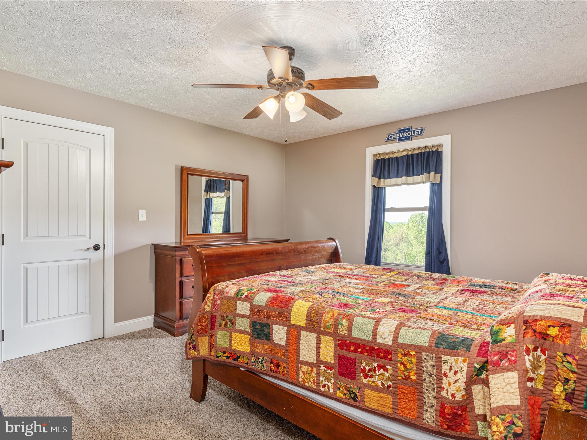 1996 Buck Mountain Road Bentonville, VA 22610 - Photo 21 of 61 a bedroom with a bed and a chandelier
