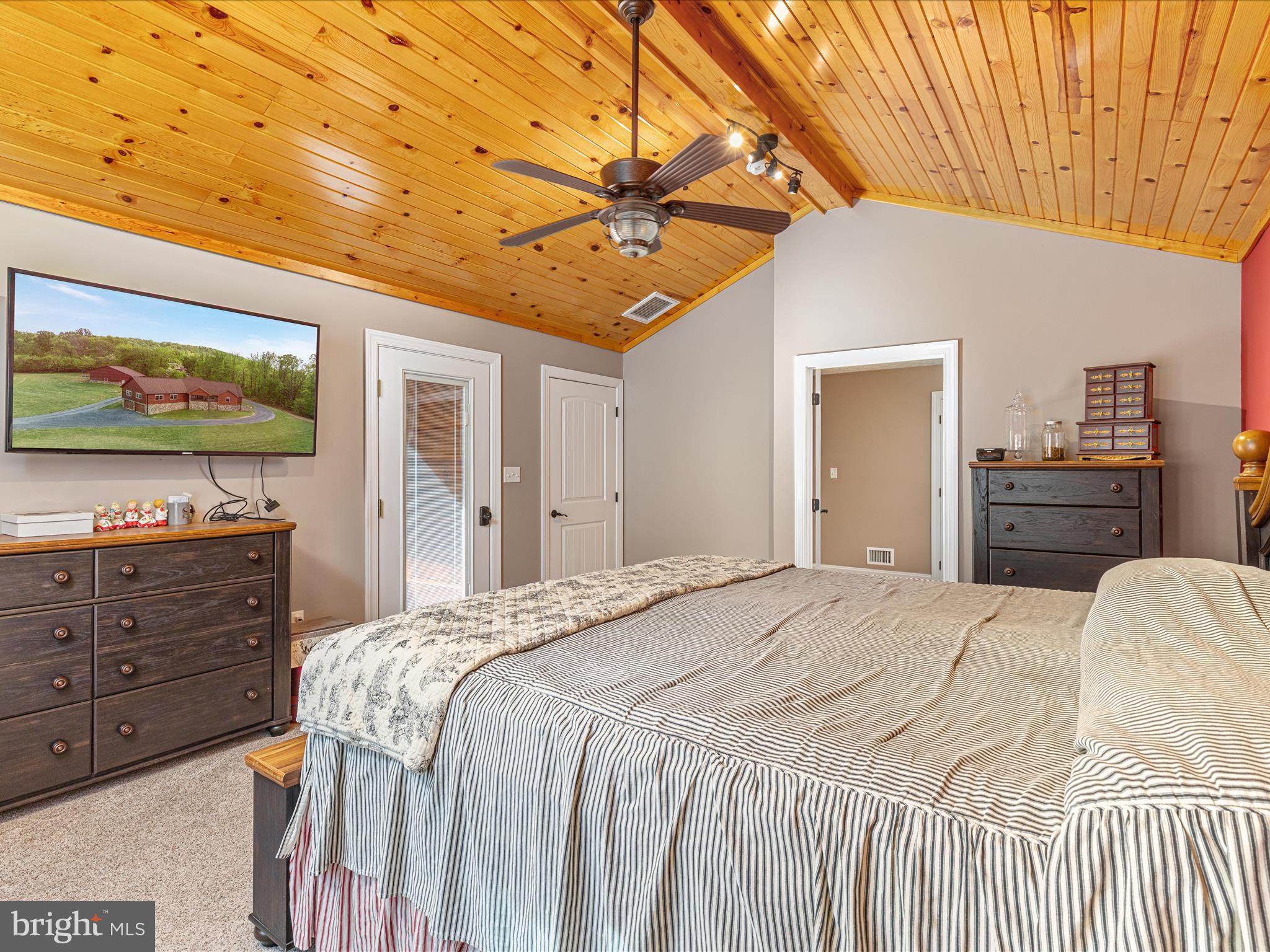 1996 Buck Mountain Road Bentonville, VA 22610 - Photo 25 of 61 a bedroom with a bed and a flat screen tv