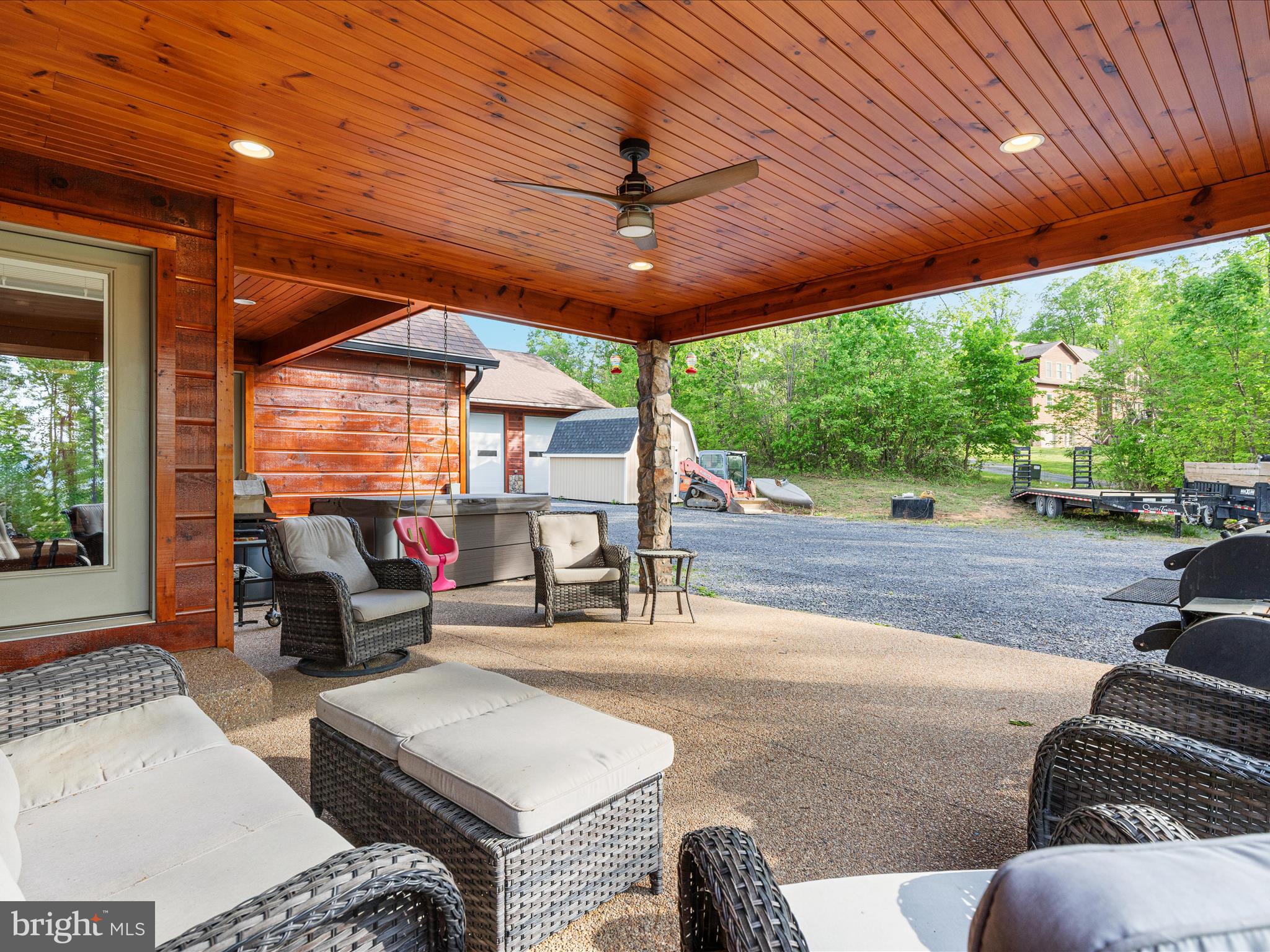 1996 Buck Mountain Road Bentonville, VA 22610 - Photo 36 of 61 a living room with patio furniture and a fireplace