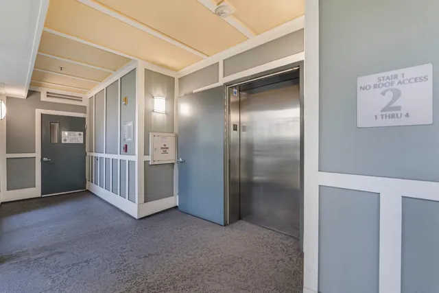 a view of a building with sitting area