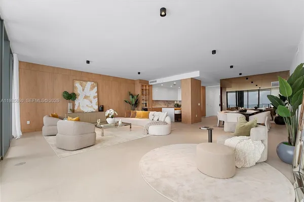 a living room with furniture and white walls